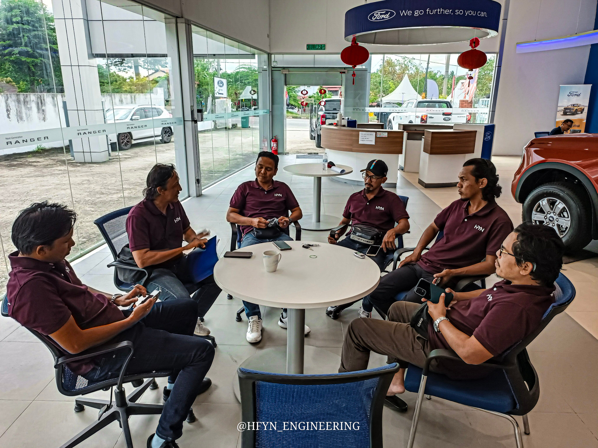The HFYN team in a pre-shift programme briefing at a showroom
